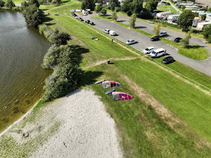 Parking and camping right by the spot, a grassy area for setting up your rig, a small sandy beach, and plenty of space on the water. What more could you want?