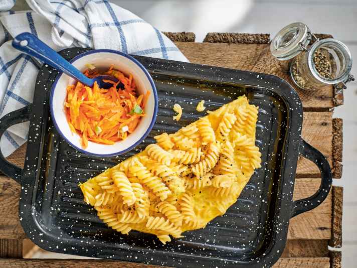 Pasta omelette with carrot salad.