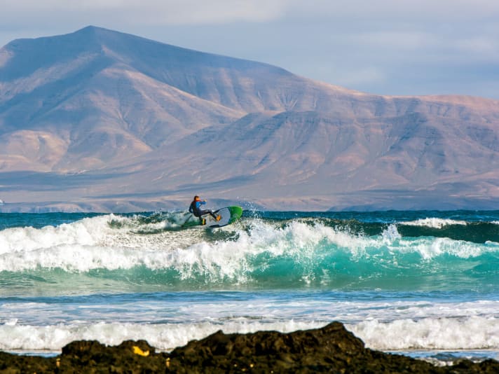 Close enough to touch: if you catch waves at Rocky Point, the volcanic landscape of Lanzarote is always at your back.