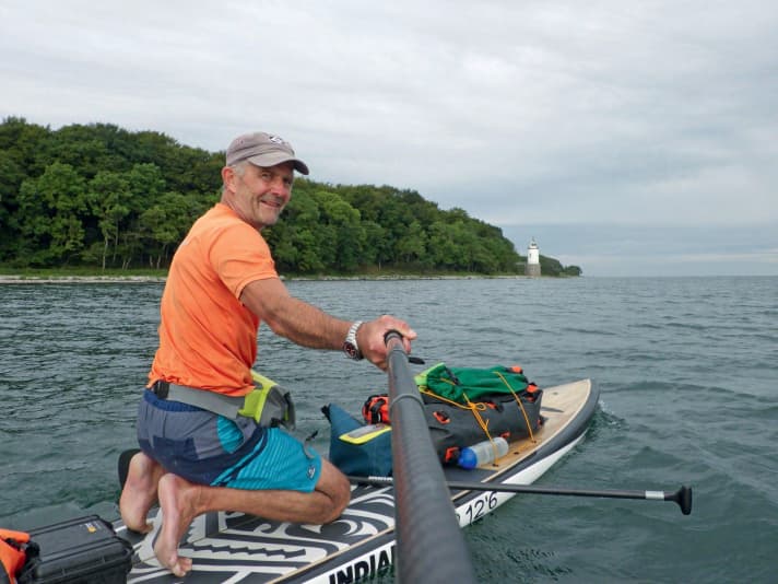 The Taksensand Fyr lighthouse points the way on the water.