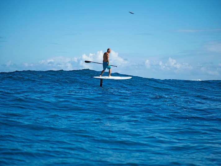 "I'm not spiritual," says Schweiger, "but the sea is more than a sports ground for me." Schweiger particularly enjoys SUP foiling over swells down the coast, from Maliko Bay to Kanaha. "Pull the paddle hard a few times and you're gliding along the entire North Shore.