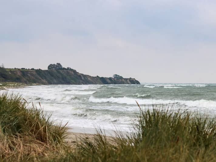 When the wind blows from the east-east, beautiful waves roll into the sandy bays in Klintholm harbour.