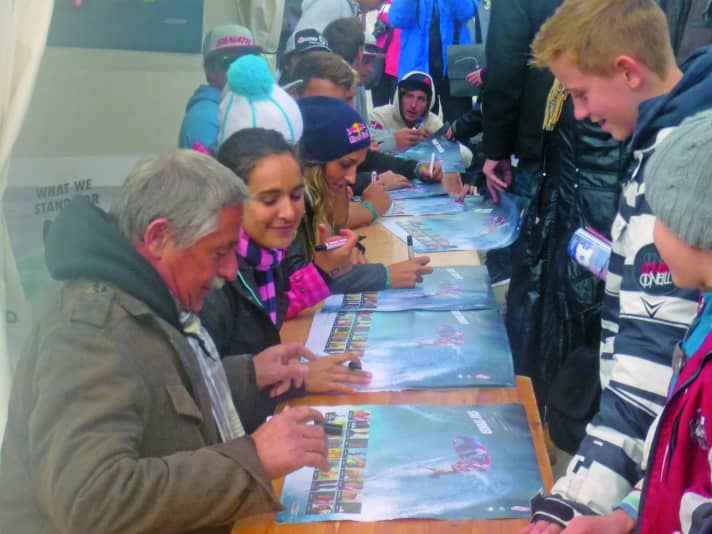"The spectators probably thought I was the manager of the pros." Paul Effner hands out autographs.