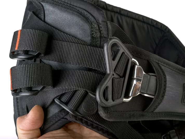 The hook plate is held in place by four straps, but cannot be significantly adjusted in height.