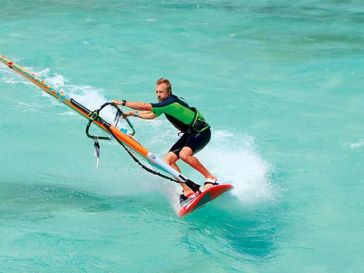 Lean your body far into the bend and push your knees forwards - this will give you enough pressure on the edge