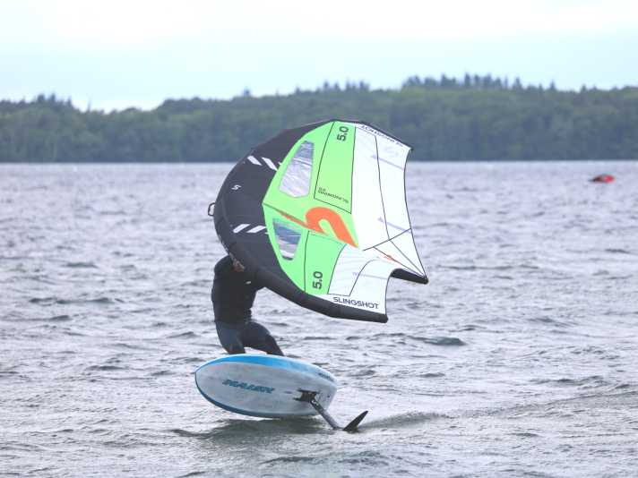 In the gusts, you can gain more altitude and thereby build up a buffer downwind