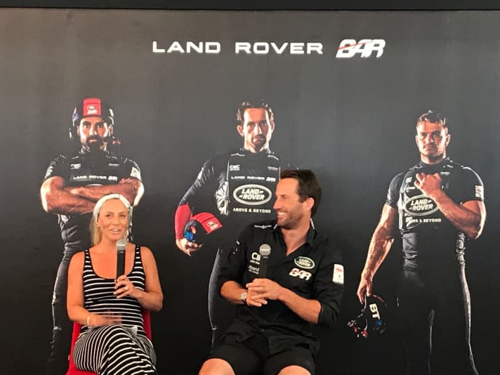   The Ainslies at the daily "Morning Show" at the base camp of Team Land Rover BAR