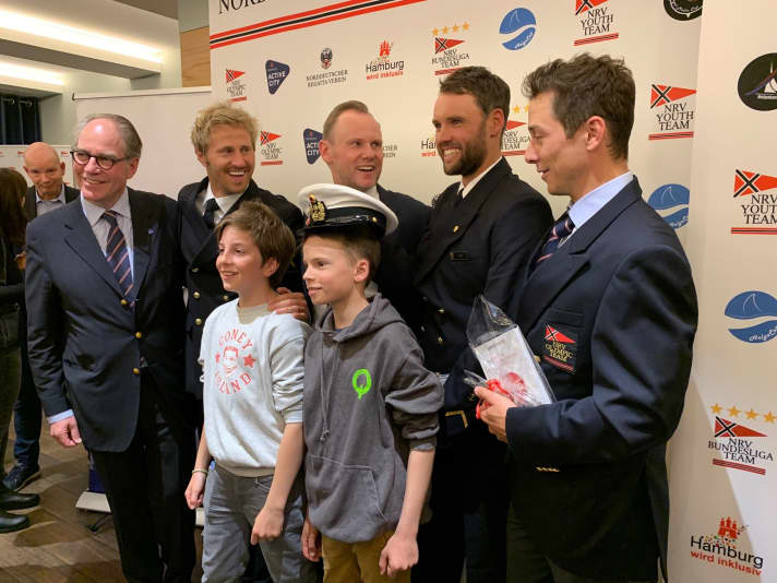   Happy celebration at the North German Regatta Club: Celebrating Laser World Champion Philipp Buhl and his team-mates Erik Heil (2nd from left) and Thomas Plößel, who won silver and bronze at the 2019 and 2020 49er World Championships within a few months. Germany's leading skiff sailors have yet to decide whether to continue their careers or retire