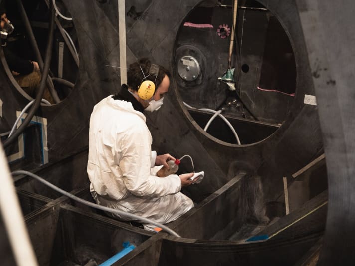   A boat builder in front of one of the bulkheads. The internal structure of the boat has been reinforced by almost 40 per cent compared to the old "Seaexplorer"