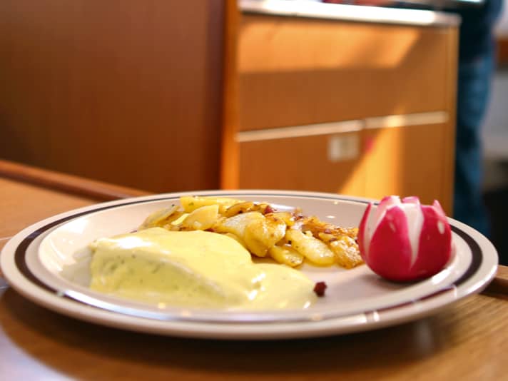 Cooking on board Fish with mustard sauce & fried potatoes