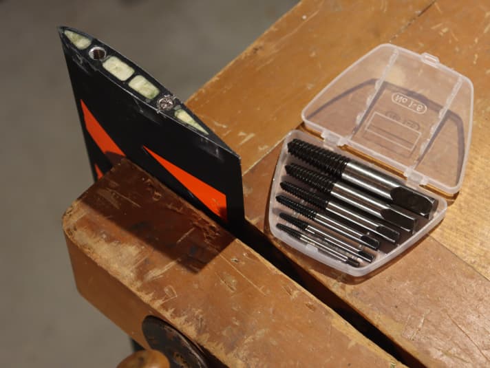 Fix the film mast in the vice, you won't need the screw extractors until later...