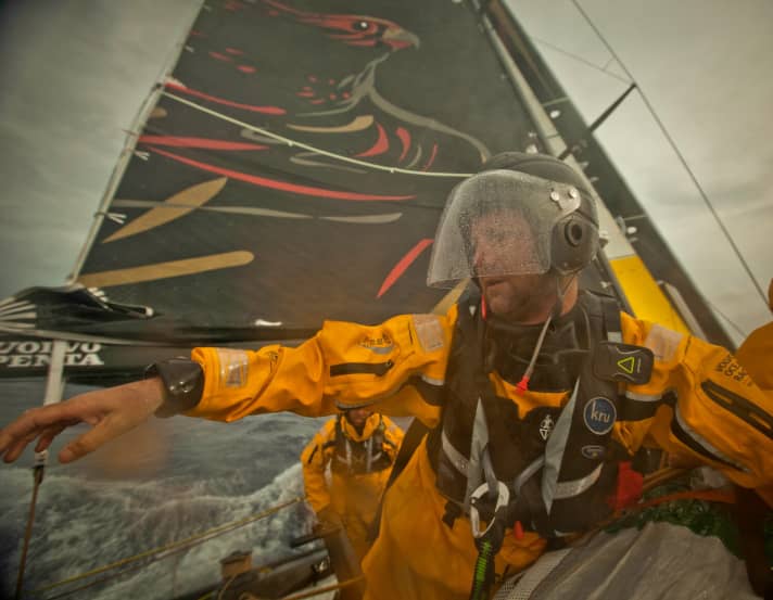   Boss with helmet: Ian Walker, the skipper of Abu Dahbi, watched by the keen eye of the hawk in the sail