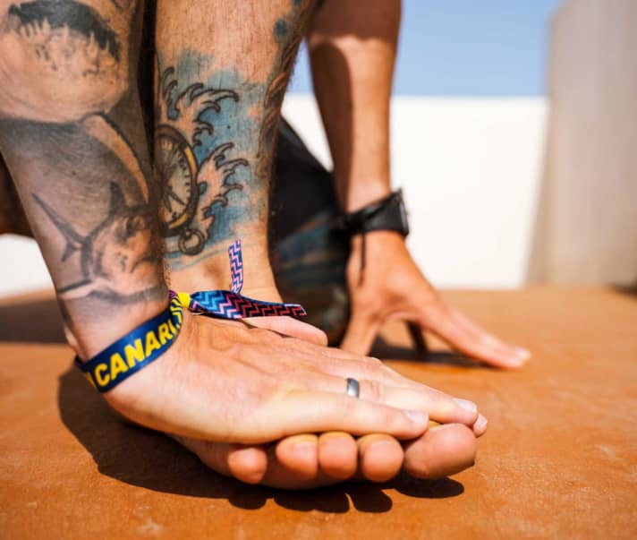 Press your toes down with the flat of your hand.