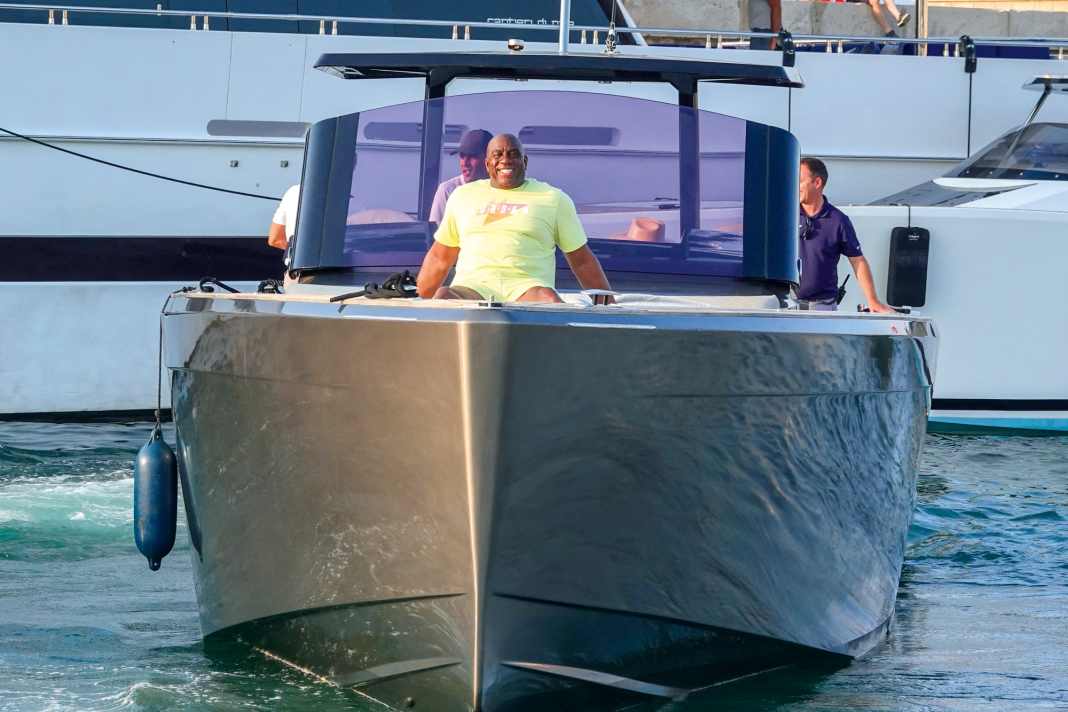 Charter fun: Magic Johnson on a chase boat