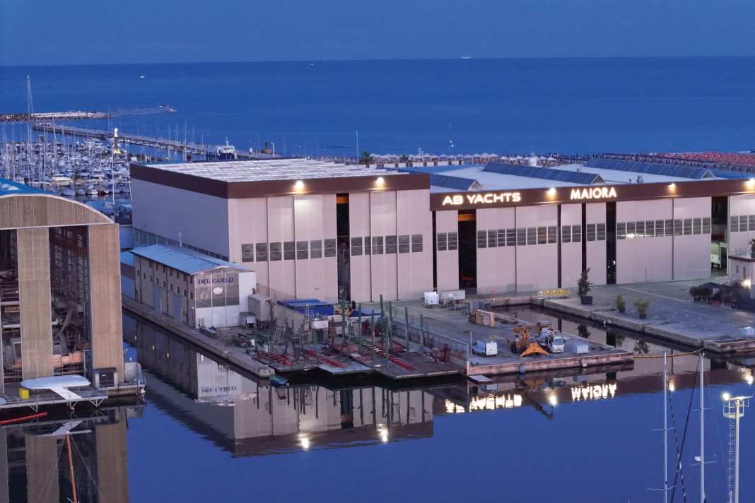 New splendour: Next Yacht Group took over the halls from Perini Navi.  Façade painters painted over the blue. A bridge leads to the showroom.