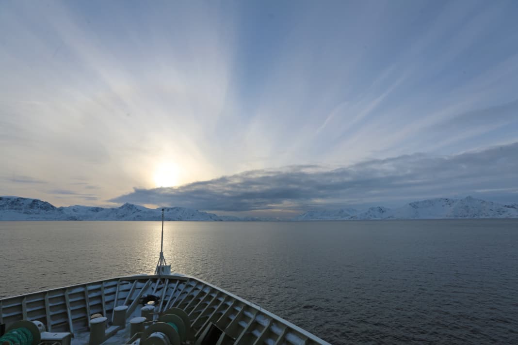 The round trip from Bergen to Kirkenes and back takes eleven days. Short days in winter: the "Trollfjord" at sea in the early afternoon between Hammerfest and Tromsø