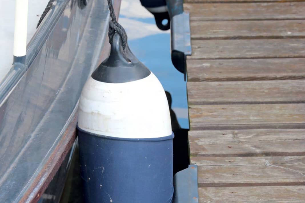 1] Long fender on a ship's side