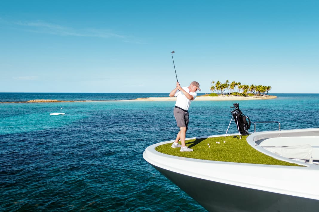 Wide field: "Gene Machines" First Engineer tries to hit the green in the blue in the Bahamas.  If the ball lands in the liquid bunker, it dissolves and becomes fish food
