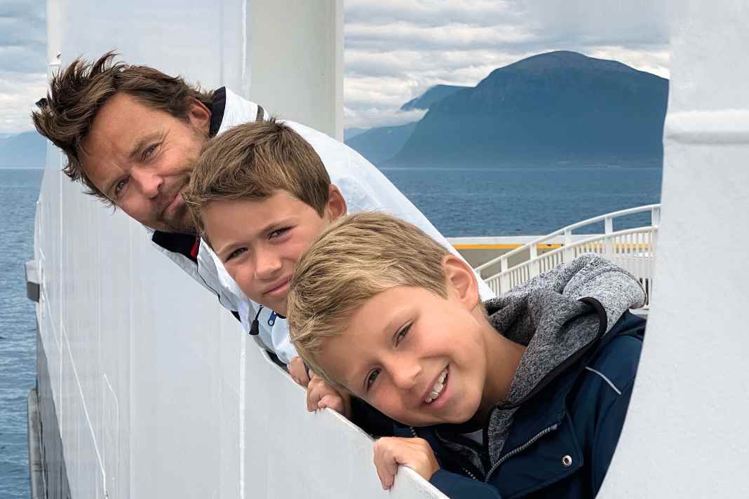 Fjord transport: Peder Eidsgaard spends his summers in his holiday home on Norway's south coast with his sons Sebastian, Nicolai and his wife Ewa.