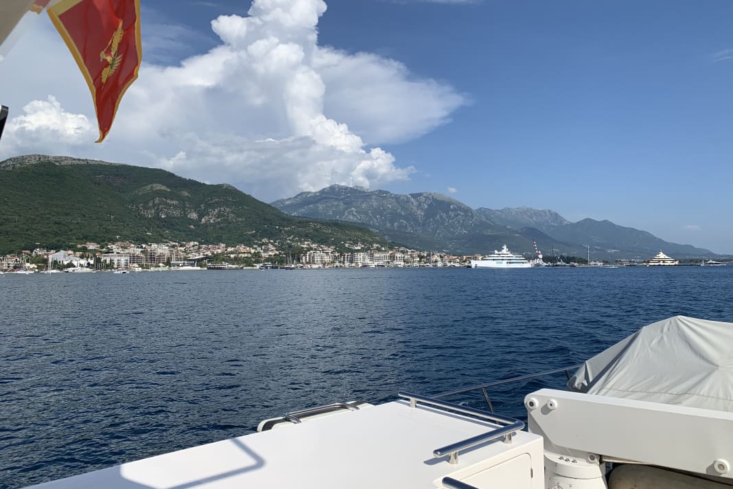 The "Azura" with the guest flag of Montenegro in Porto Montenegro