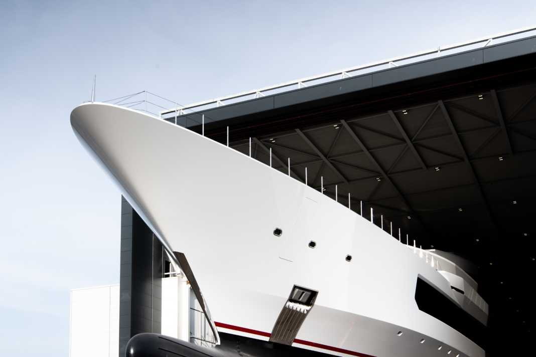 The Oceanco Y726 pushes its nose out of the Oceanco hall.