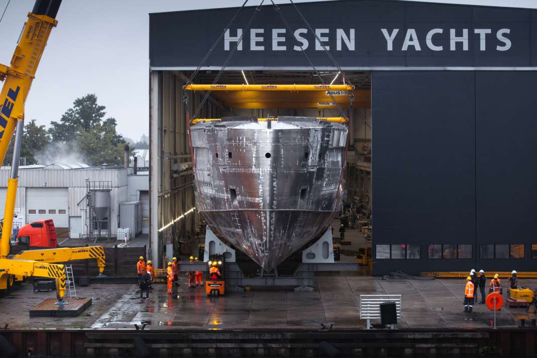 The aluminium body slowly rolls out of the hall.