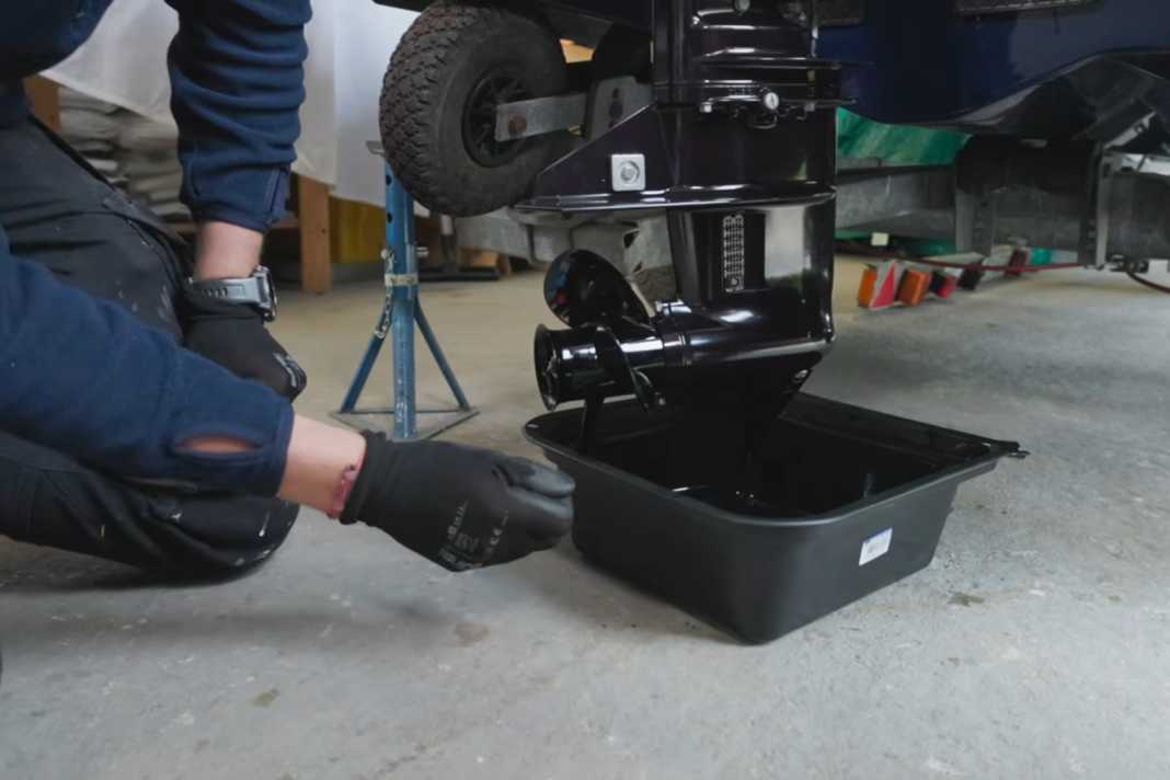 Place an oil drip tray under the engine.