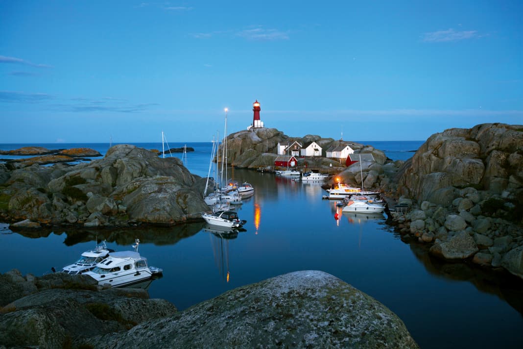 The natural harbour of Svenner. Our "Rolling Swiss 2" is brightly lit on the right