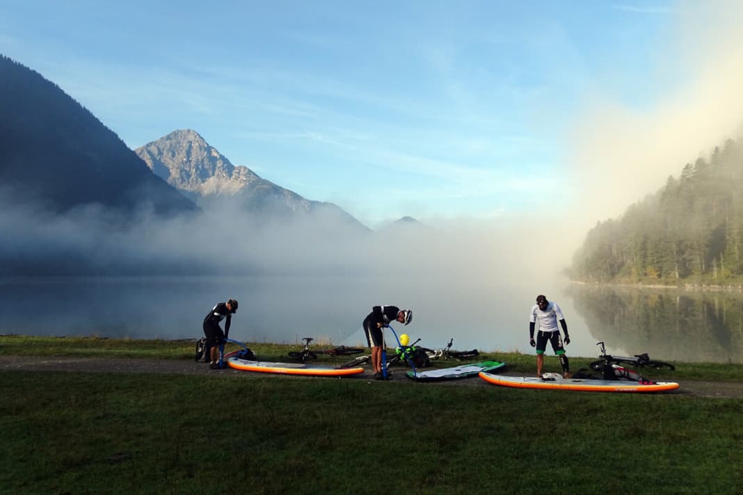 All is still right with the world at Lake Heiterwanger See. After a short bike ride from Reutte, pumping up the boards is a sporty diversion.