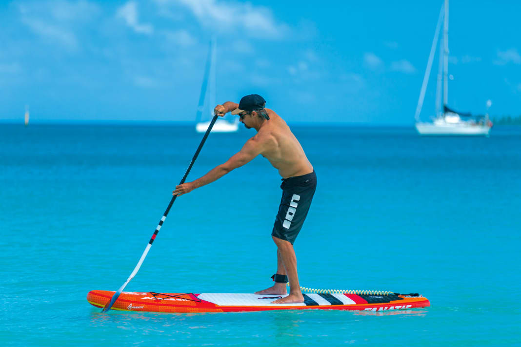 Firstly, make sure your feet are centred on the board, on both sides of the handle. Your feet should be parallel or very slightly offset so that you can use your hips optimally
