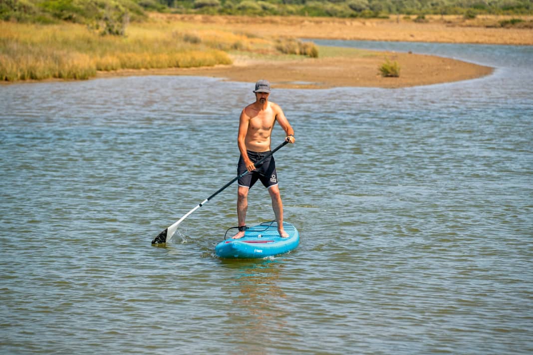 For example, if you are paddling on the right-hand side, you bring the paddle down while maintaining the same hand position...