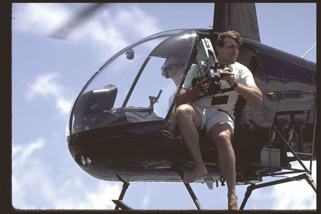 Helicopters were in constant use for the photo shoots. Here with cult filmmaker Robert Masters.