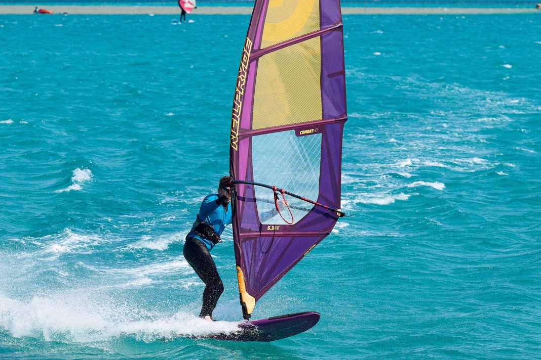 Initiate the push tack like an upright power jibe to leeward...