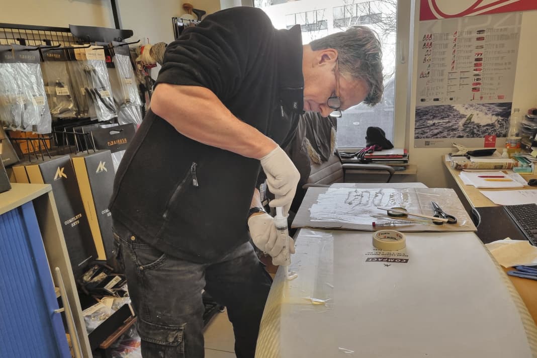 A real surfer's office: Sven Grunwald, from AK and Starboard in Germany, turns the desk into an operating table.