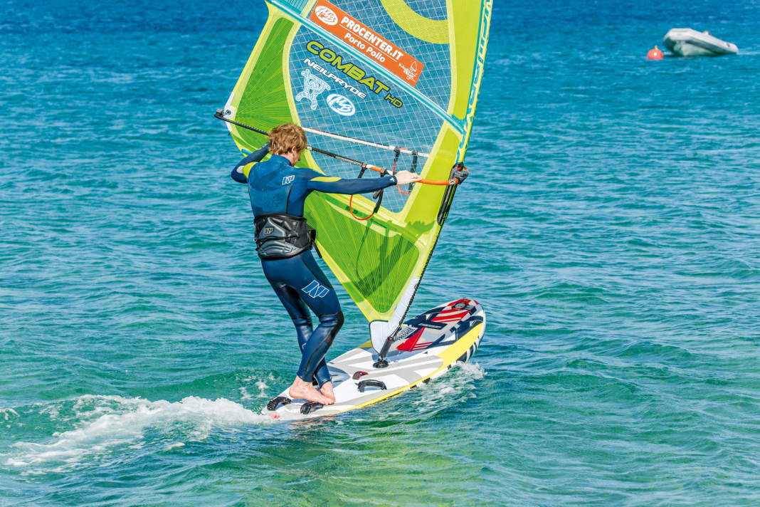 Ride a basic jibe and change the foot position to downwind as usual