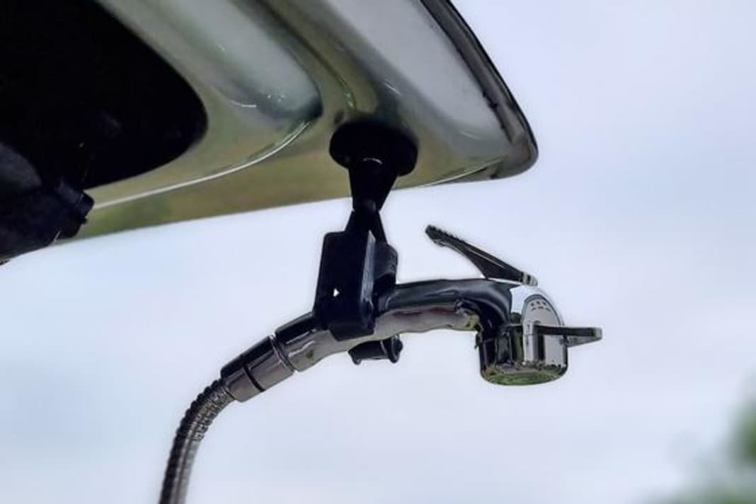 A magnetic holder for the shower head and other camping gadgets make van life more pleasant!