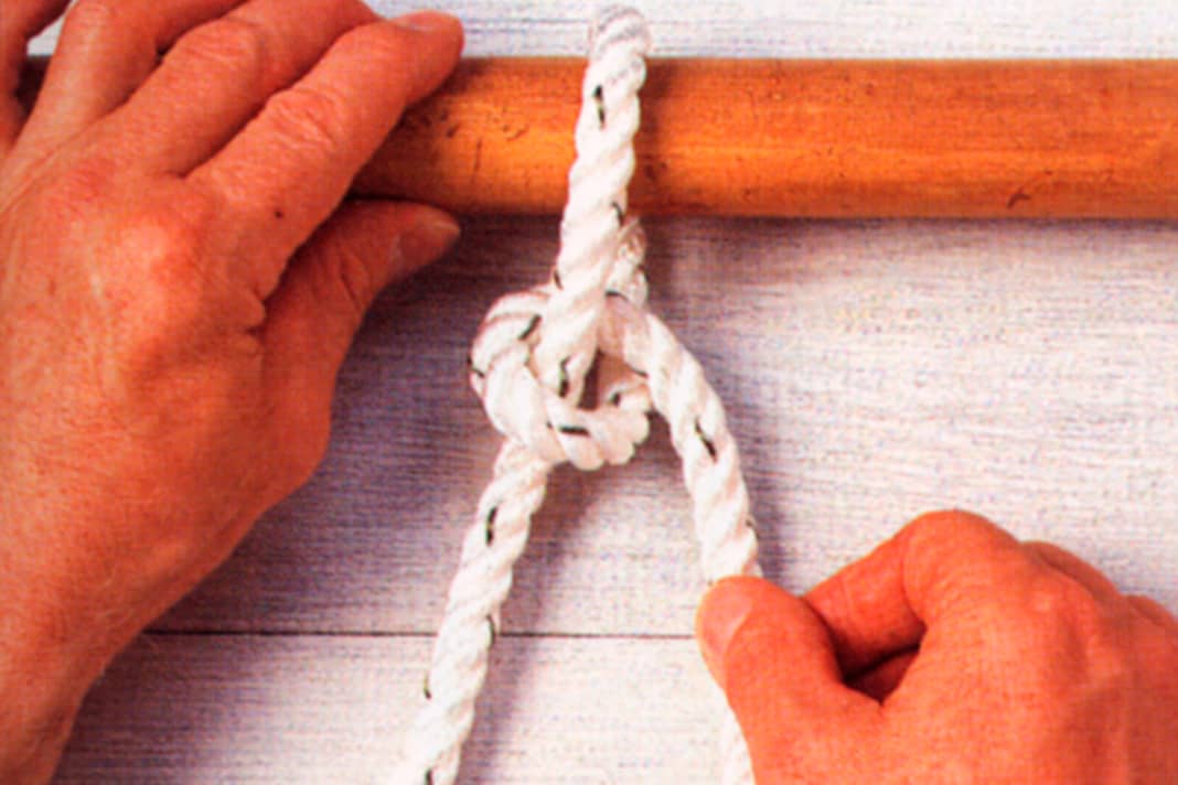 Place the working end around the attachment point. Make a half stroke around the standing part.