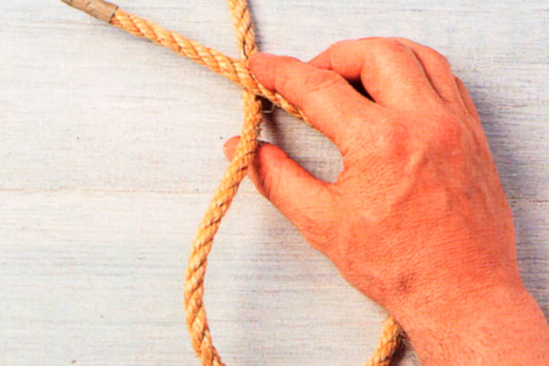 Lay an overhand loop with the working end.