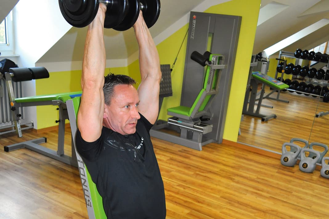 Neck press: Hold the dumbbells vertically above your head with your arms straight. Then slowly lower them sideways as far as you can ...