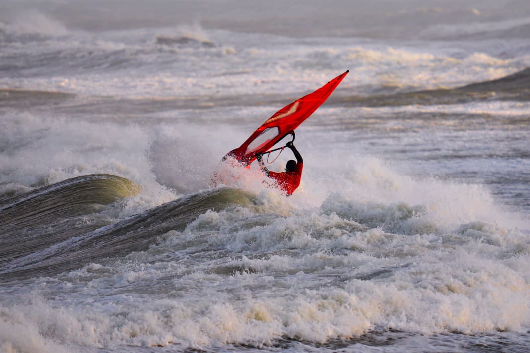 Christian Kohl takes on a North Sea breaker in the morning light