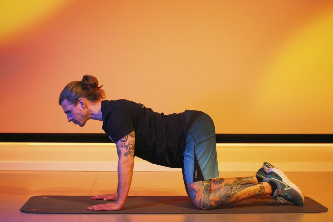 Start in a quadruped position with your hands under your shoulders and your knees under your hips. Inhale and let your belly sink as you look up and arch your back