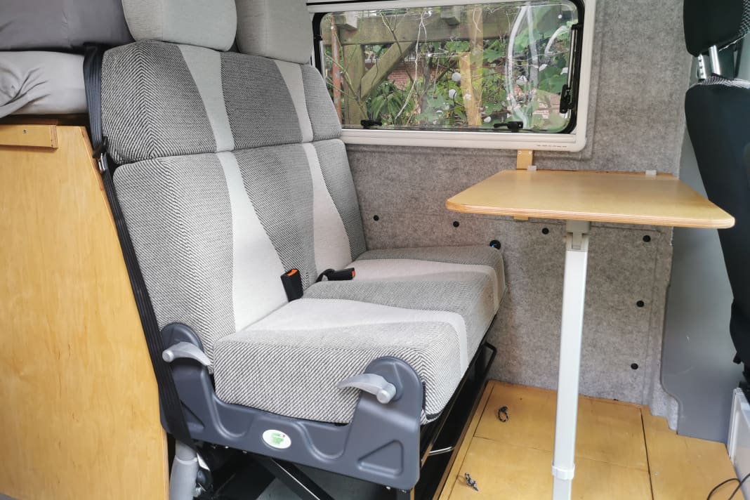 The seating area can be converted into a bed with folding benches