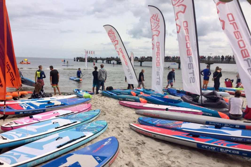 Test boards are available at most events, like here from Starboard.