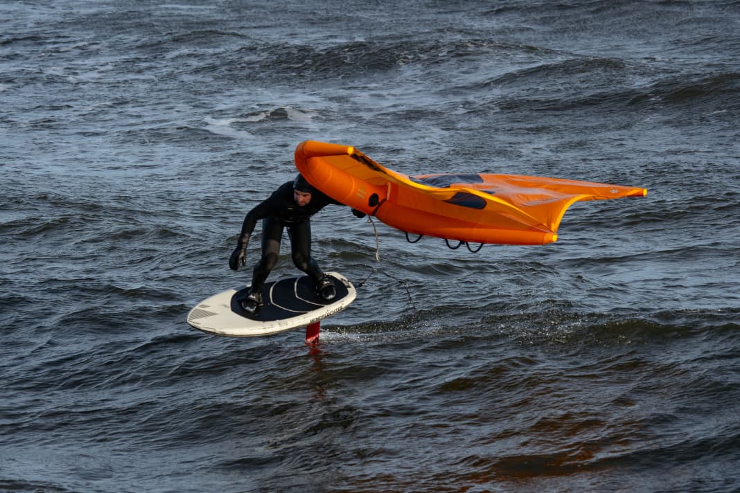Wave riding in the goofy position (right foot in front)