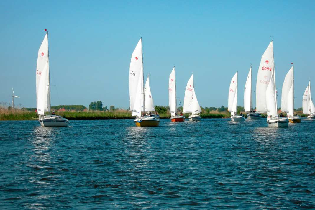 Fam flotilla on the Frisian canals. The sheltered inland area is ideal for small dinghy cruisers