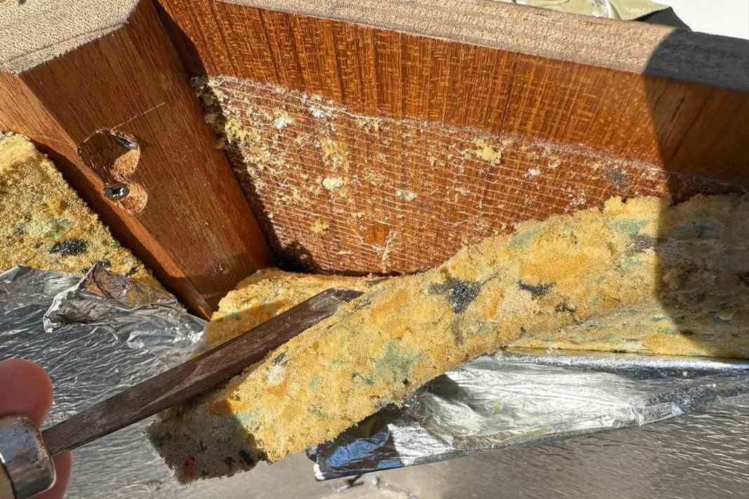 The old insulation must be completely removed. The foam board comes off easily, a pry bar helps. However, the adhesive remains on the substrate.