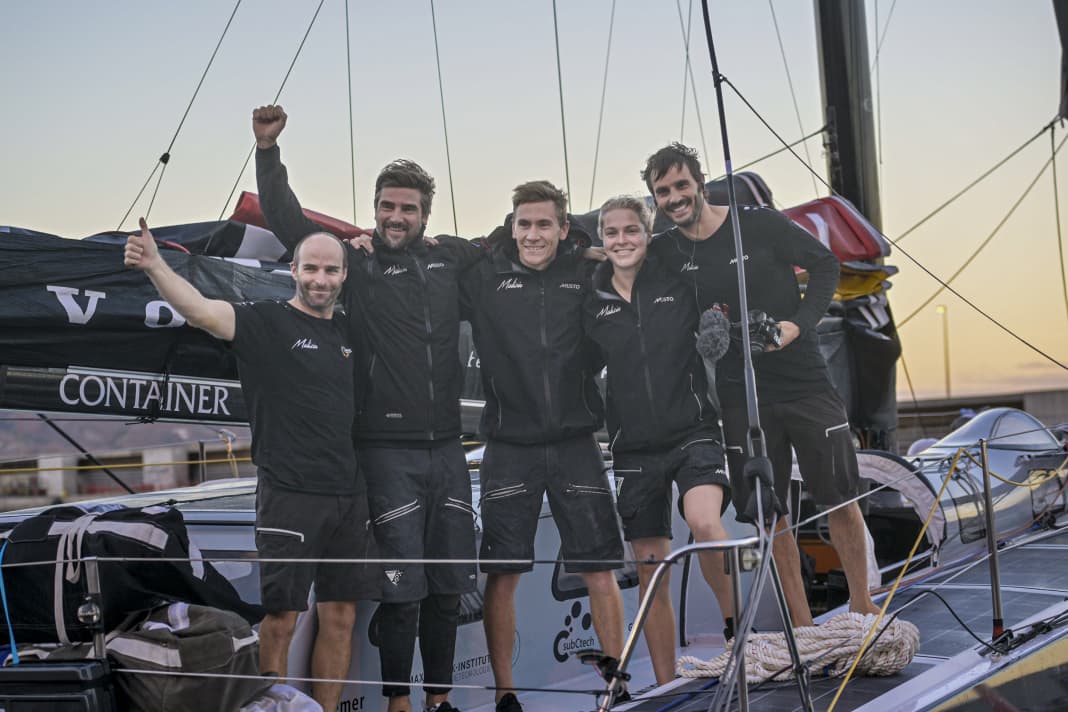 Team Malizia celebrates third place at the start of the Ocean Race after crossing the finish line of stage one in Mindelo