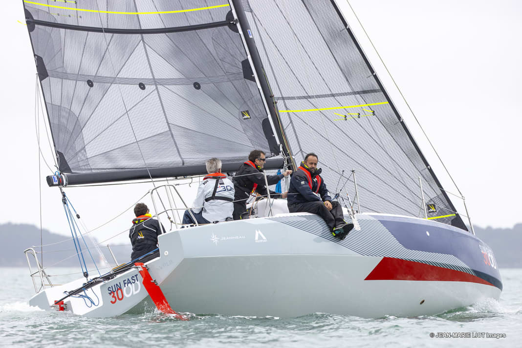 Two rudder blades are attached to the stern. The boat is steered using the tiller