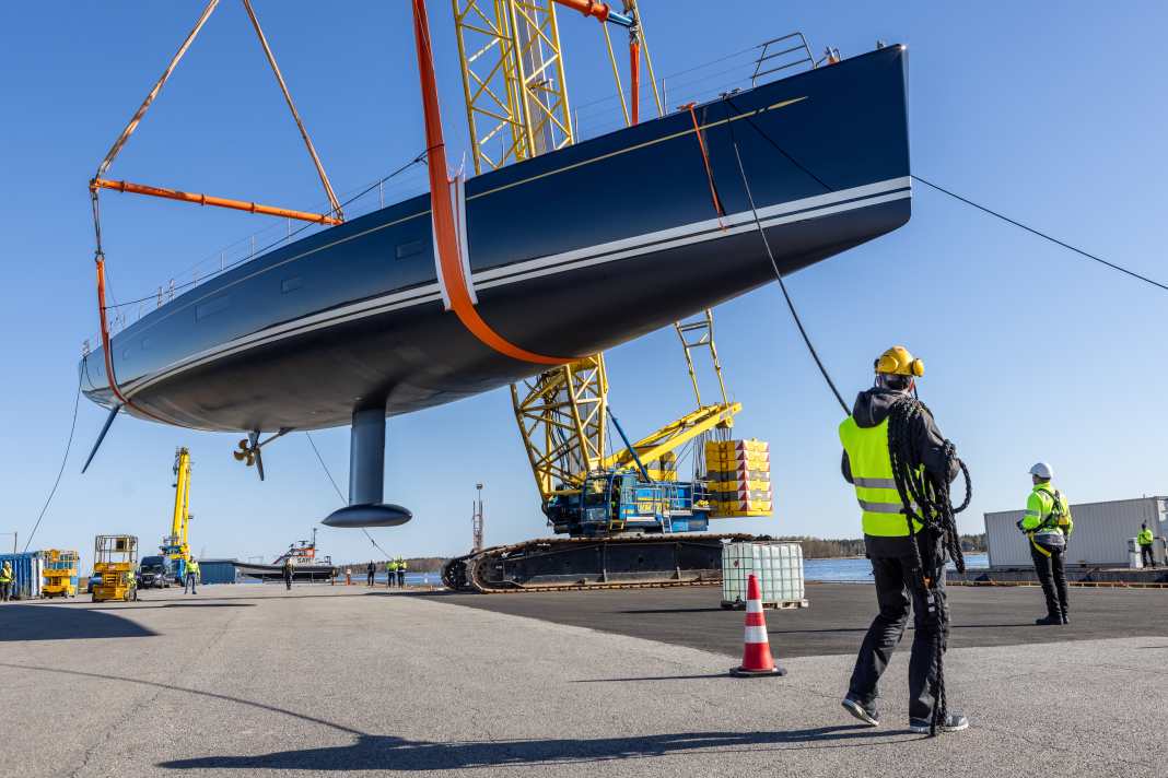 The Swan 128 hangs from the crane.