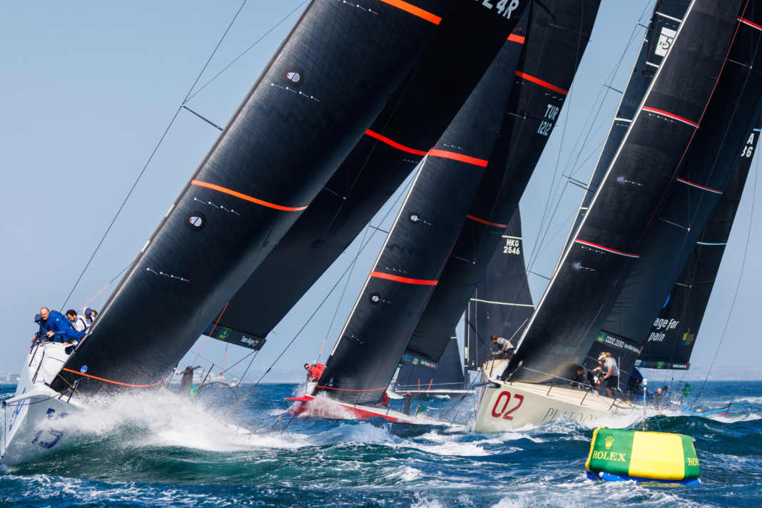 Strong winds, plenty of waves: the Rolex TP52 World Championship got off to a furious start off Cascais. Platoon Aviation" can be seen with bow number 2.